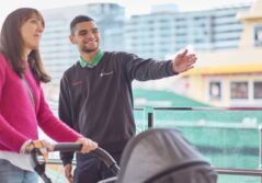 Woman pushing a pram asking for directions